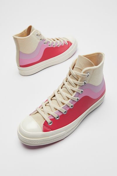cream converse painted with shades of pink