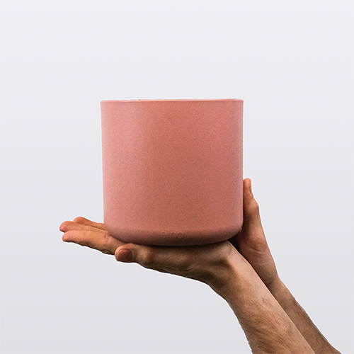 Hands holding a medium pink plant pot. This image links to Enkei (Medium)'s product details page.