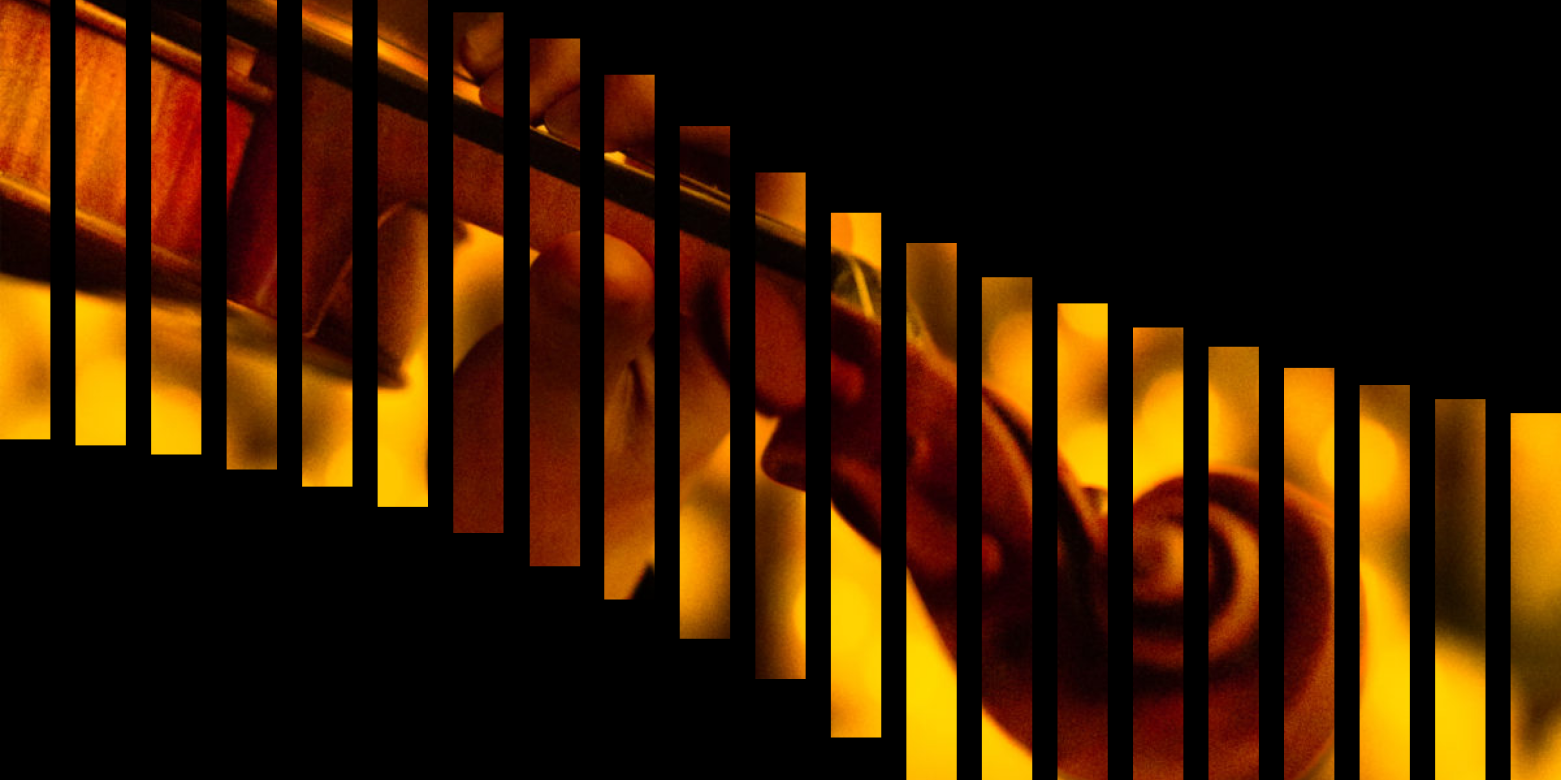 cello and piano player playing their intruments surrounded by candles 