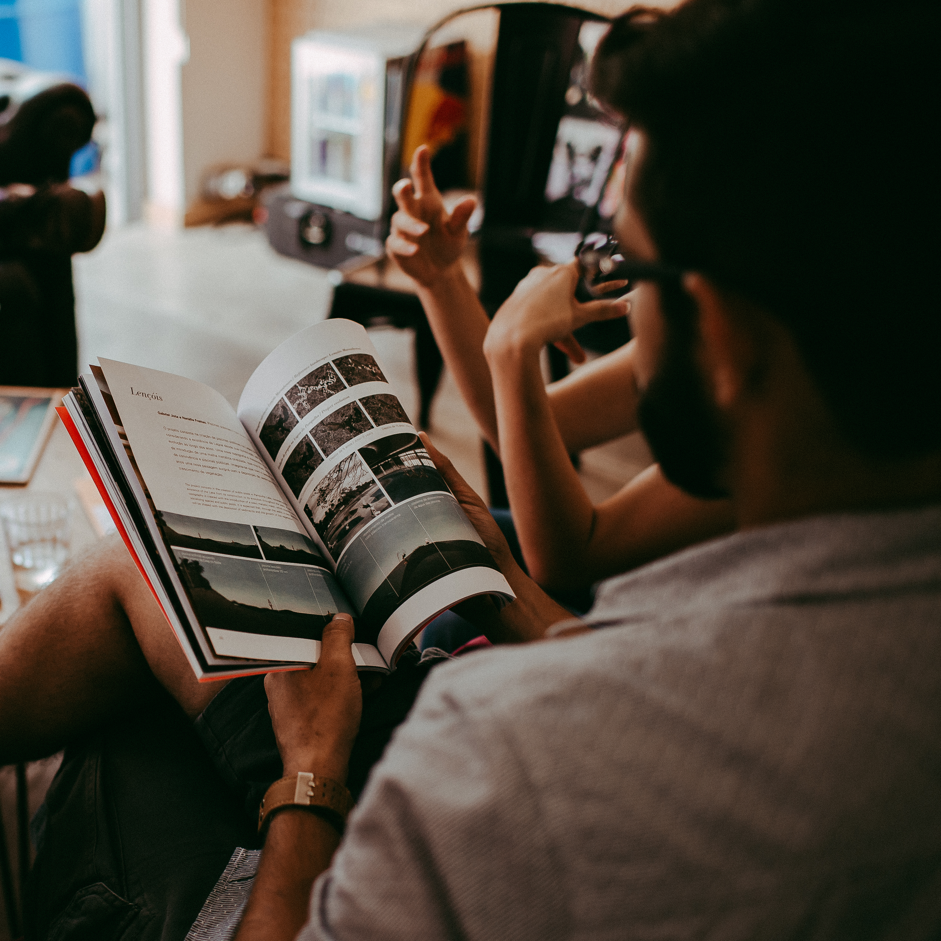 Image of a man reading a magazine